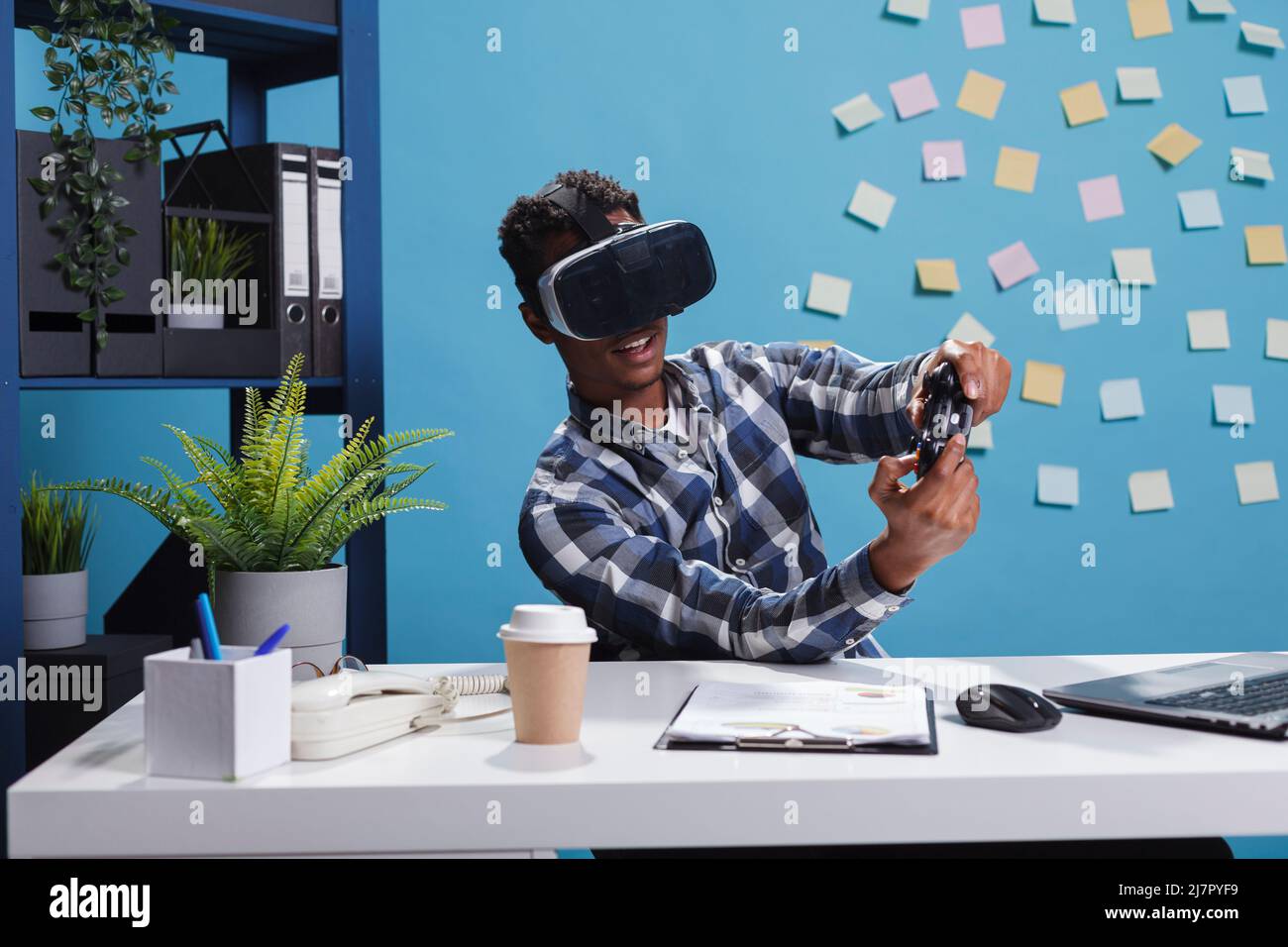 Playful office person wearing virtual reality technology headset while