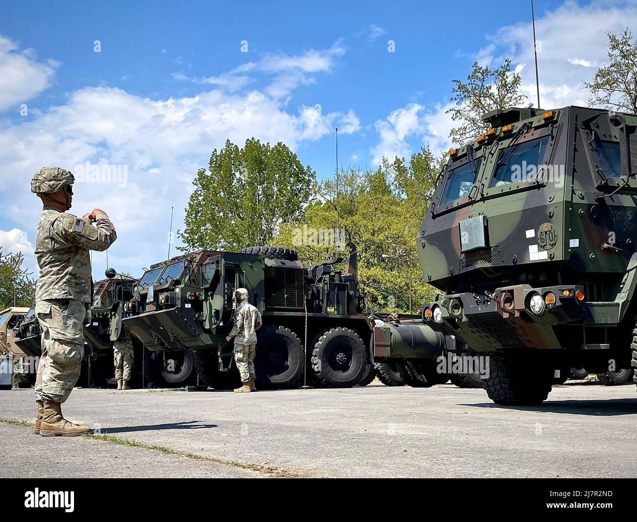 A Soldier from the 62nd Engineer Company ground guides a vehicle at the Equipment Configuration and Hand-off Area in Lešt’, Slovakia, May 9. The 405th Army Field Support Brigade issued a full complement of Army Prepositioned Stocks-2 rolling stock and additional equipment pieces to the U.S.-based engineer company deployed to Europe for DEFENDER-Europe 22. (Photo by Lt. Col. Miguel Flores) Stock Photo