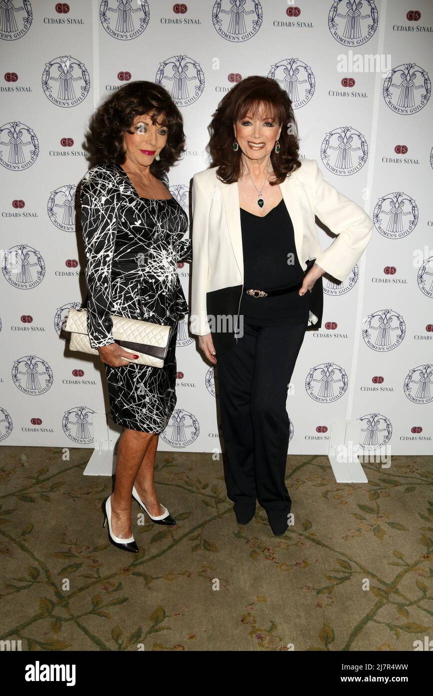 LOS ANGELES - APR 22:  Joan Collins, Jackie Collins at the Women's Guild Cedars-Sinai Luncheon at Beverly Hills Hotel on April 22, 2014 in Beverly Hills, CA Stock Photo