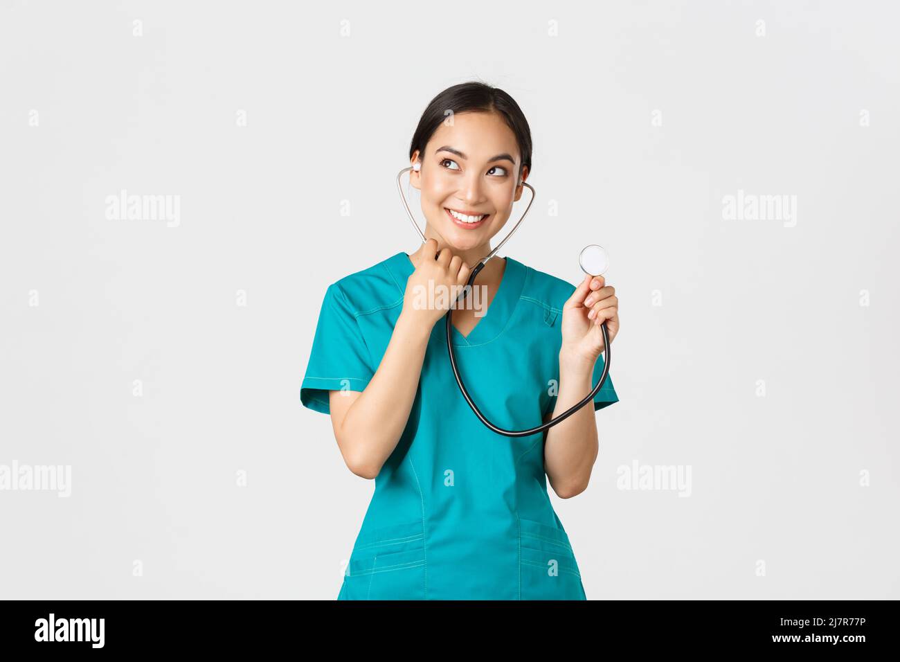 Cute asian nurse using stethoscope hi-res stock photography and images ...
