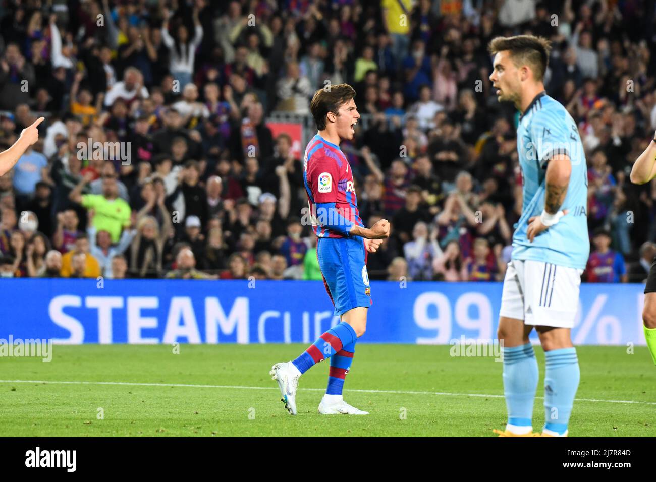 BARCELONA, SPAIN - MAY 10: Riqui Puig of FC Barcelona celebrates after his team scoring a goal during La Liga match between FC Barcelona and RC Celta de Vigo at Camp Nou on May 10, 2022 in Barcelona, SPAIN. (Photo by Sara Aribo/PxImages) Stock Photo