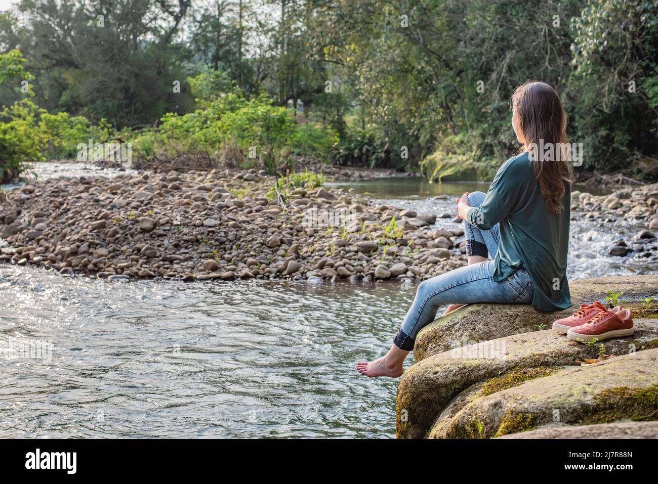 Barefoot woman jeans hi-res stock photography and images - Alamy