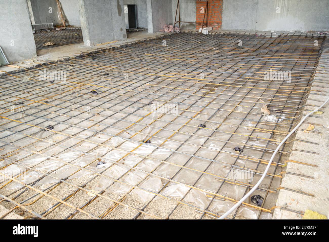 reinforcing mesh for pouring the floor in the room of a monolithic structure, selective focus Stock Photo