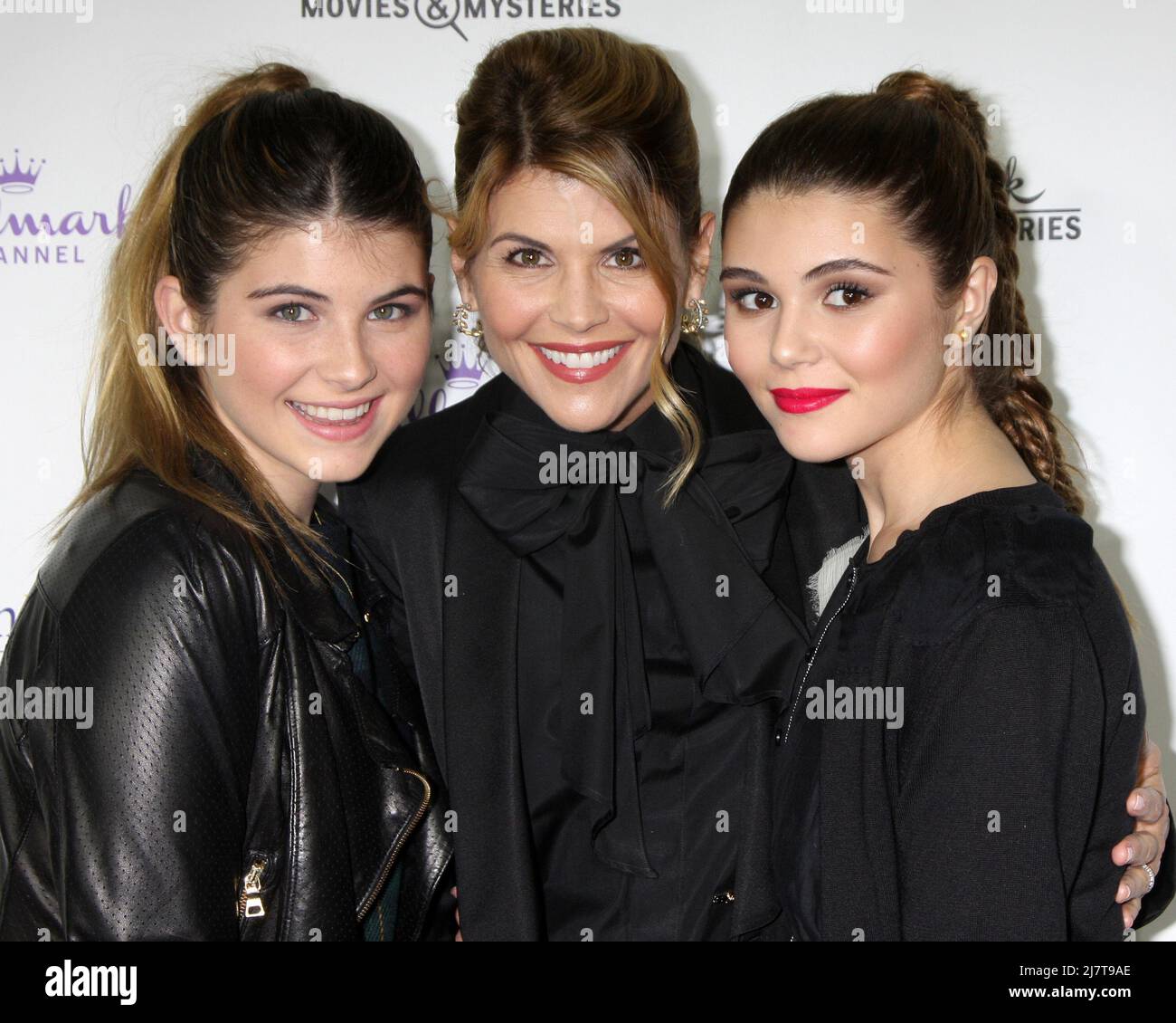 LOS ANGELES - NOV 4:  Lori Loughlin, daughters Isabella Rose Giannulli, Olivia Jade Giannulli at the Hallmark Channel's 'Northpole' Screening Reception at the  La Piazza Restaurant  at The Grove on November 4, 2014 in Los Angeles, CA Stock Photo