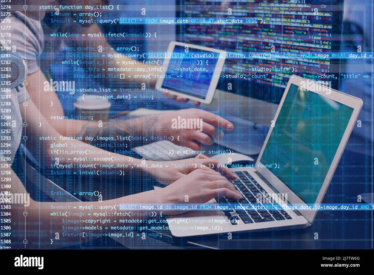 Double exposure of programmers in office and computer code Stock Photo