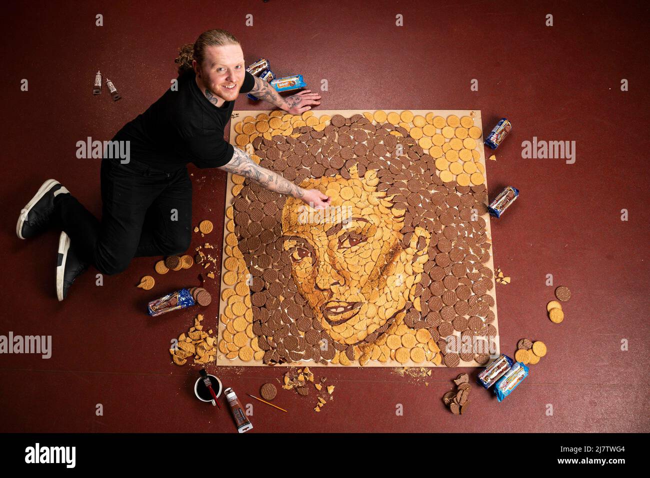 EDITORIAL USE ONLY Food artist, Nathan Wyburn puts the finishing