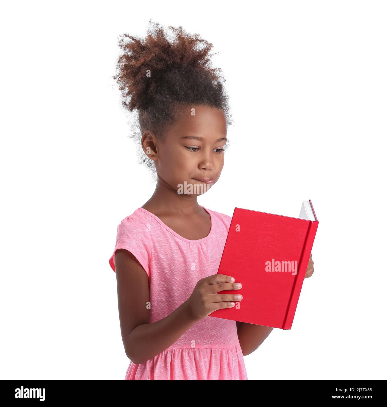 Little African-American girl reading book on white background Stock ...