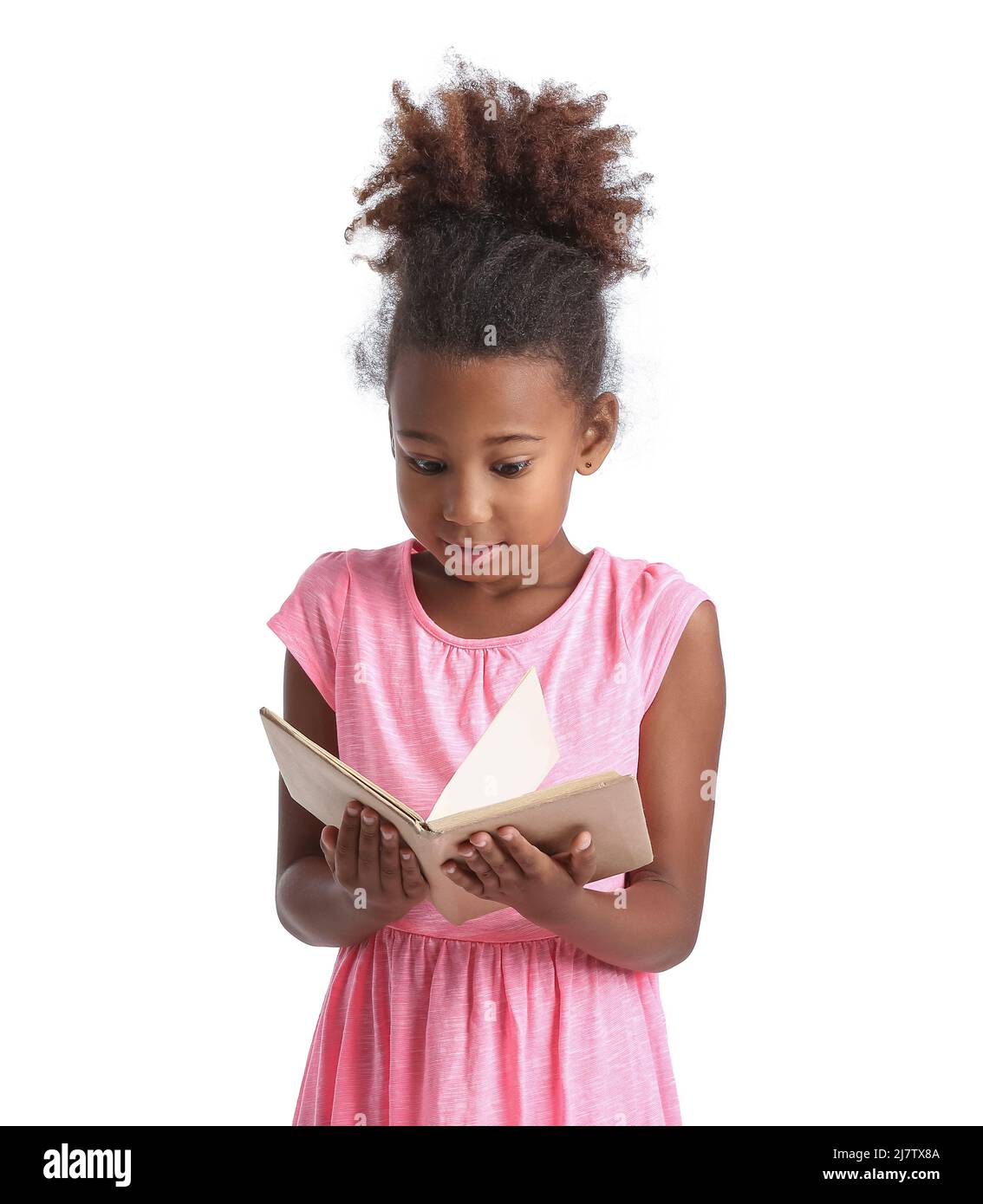 Little African-American girl reading book on white background Stock ...