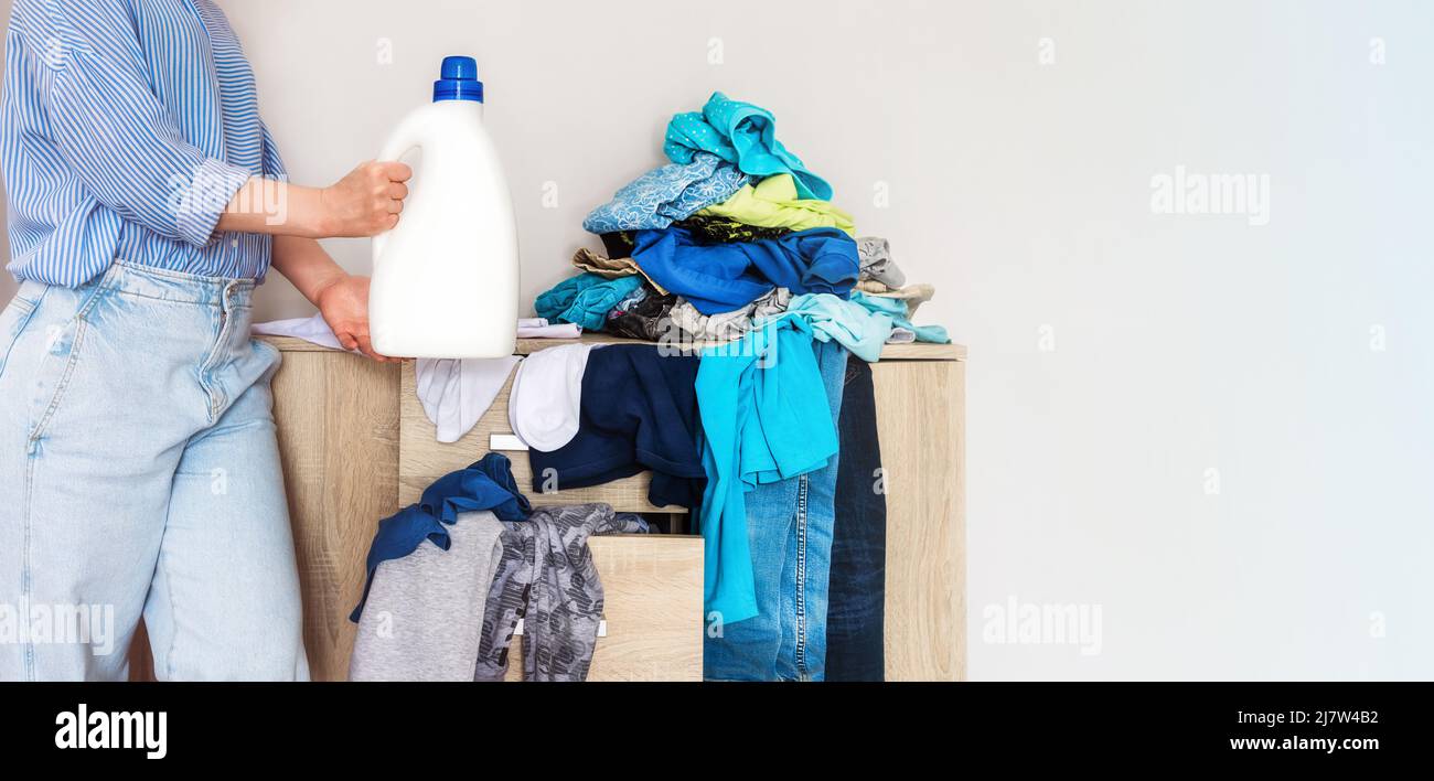 closeup of woman's hands holding a bottle of laundry detergent, mockup