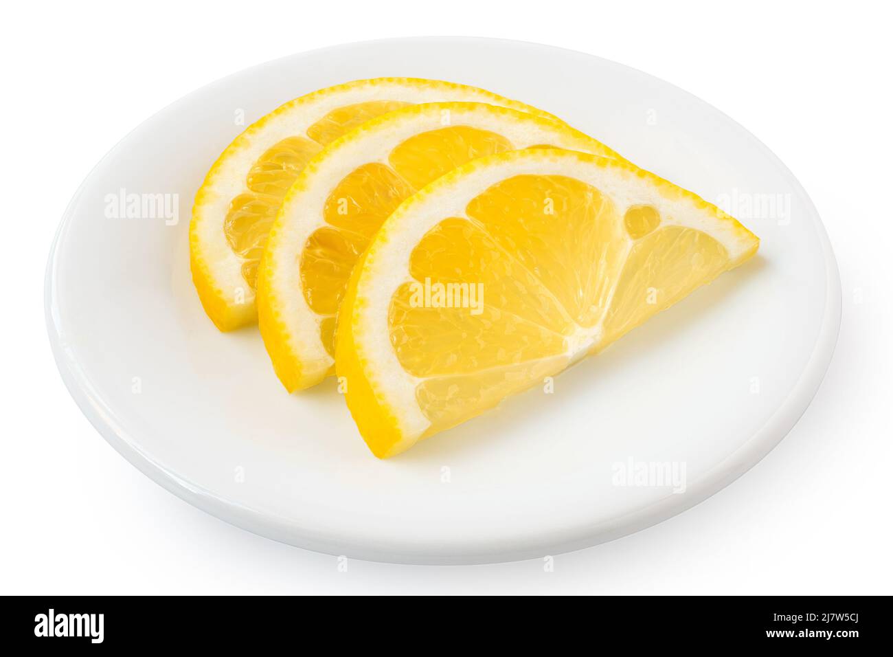Three half slices of fresh lemon on white ceramic plate isolated on white. Stock Photo