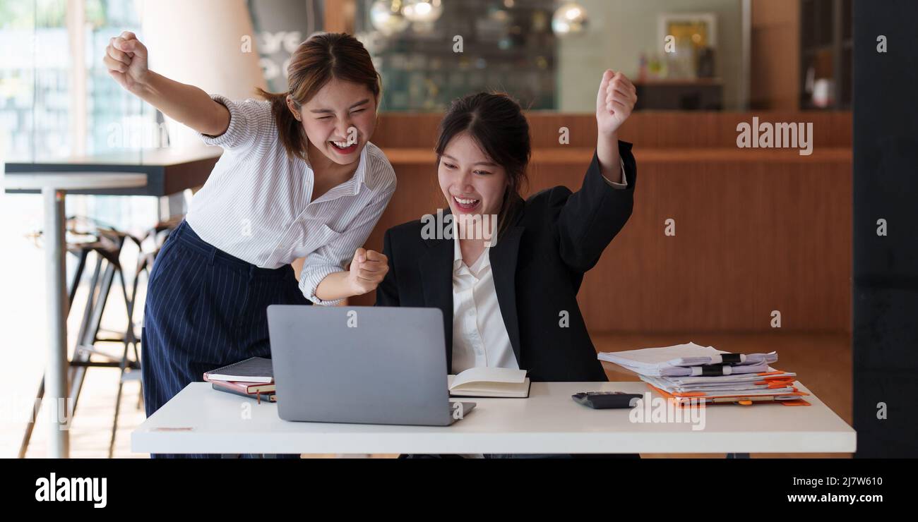 Successful business team excited when her business growth. Finance concept. Stock Photo
