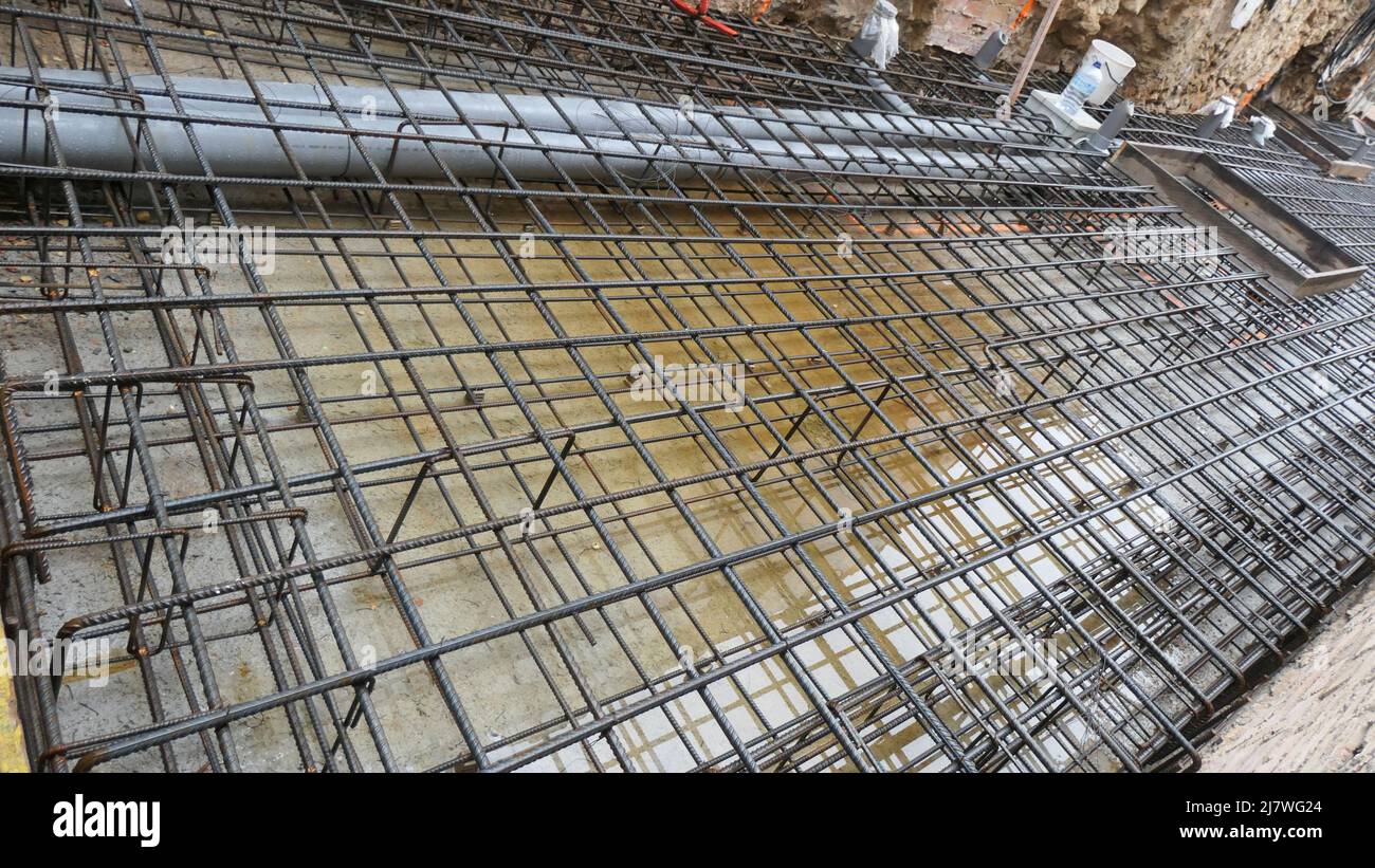 Steel bars awaiting pumped and poured concrete at construction site in central Andalusian village Stock Photo