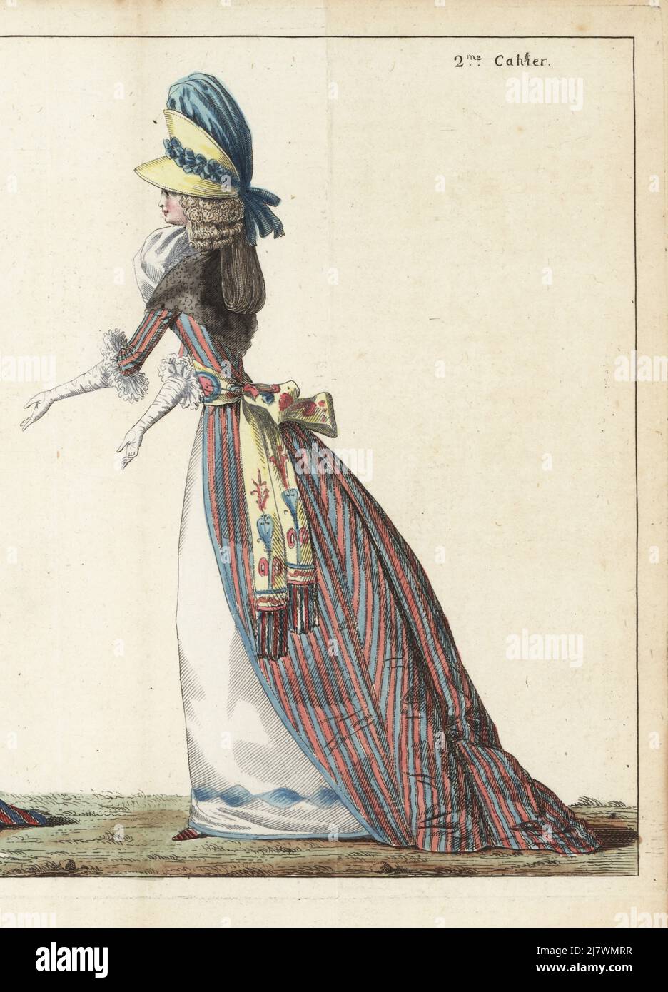 Woman in chapeau-casque of yellow satin straw and blue satin, tapet with five curls, black gauze fichu, satin robe in blue and maroon stripes, belt with arabesques and tricolor fringe, white satin petticoat with blue ribbon at hem. Handcoloured copperplate engraving from Jean-Antoine le Brun or Lebrun-Tossa’s Journal de la Mode et du Gout, previously Cabinet des Modes, Chez Buisson, Paris, and Joseph le Boffe, London, 2me Cahier, 5 March 1790. Stock Photo