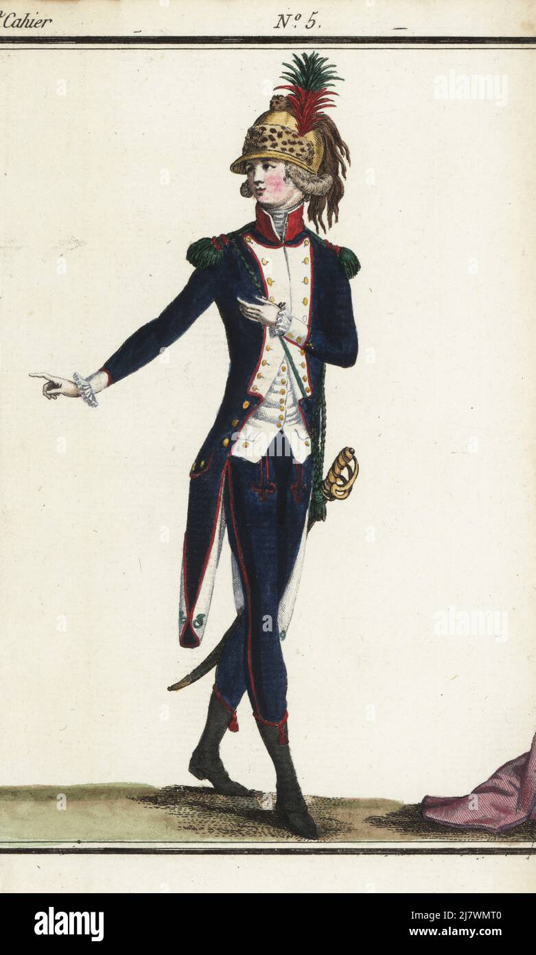 French chasseur in uniform in copper casque with tiger skin, aigrette and horse-hair tail, green epaulettes, coat like that of the Fusiliers of the Nationale Garde Parisinne, blue pantalons, brodequin garters, armed with sabre. Handcoloured copperplate engraving from Jean-Antoine le Brun or Lebrun-Tossa’s Journal de la Mode et du Gout, previously Cabinet des Modes, Chez Buisson, Paris, and Joseph le Boffe, London, 3me Cahier, 15 March 1790. Stock Photo