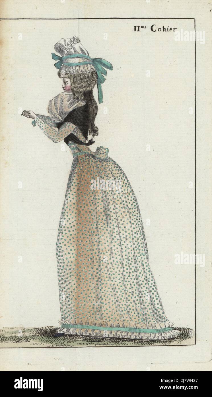 French woman in bonnet with green ribbons, hair with toupet or forelock, ringlets a la conseilliere, gauze fichu, linen pierrot jacket, white linen skirt with green polka dots. Handcoloured copperplate engraving from Jean-Antoine le Brun or Lebrun-Tossa’s Journal de la Mode et du Gout, previously Cabinet des Modes, Chez Buisson, Paris, and Joseph le Boffe, London, 11me Cahier, 5 June 1790. Stock Photo