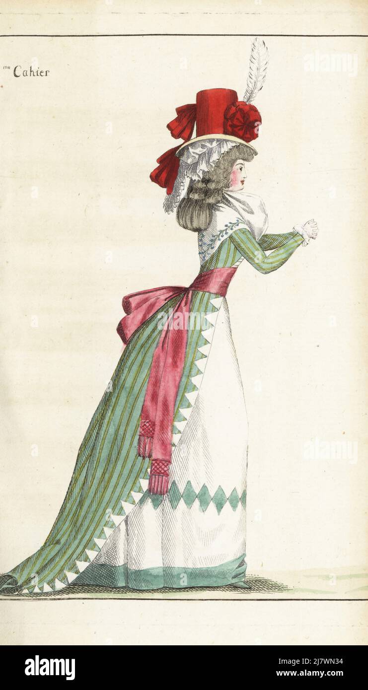 Woman in tall bonnet covered with taffeta nakara, white follette, fichu with Barbeaux border, striped green gown, pink taffeta belt, white taffeta petticoat with falbala, green slippers. Handcoloured copperplate engraving from Jean-Antoine le Brun or Lebrun-Tossa’s Journal de la Mode et du Gout, previously Cabinet des Modes, Chez Buisson, Paris, and Joseph le Boffe, London, 15me Cahier, 15 July 1790. Stock Photo