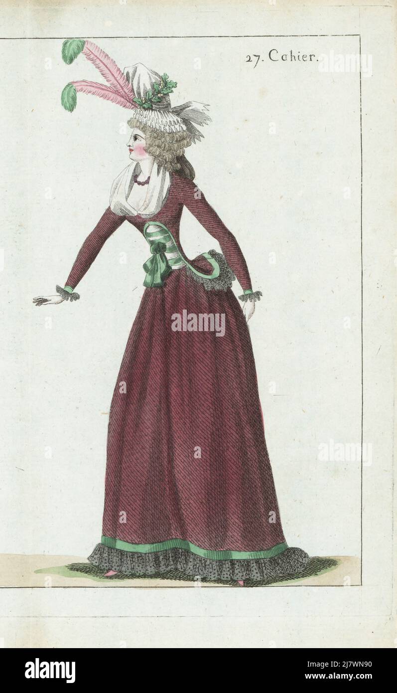 Woman in white gauze bonnet decorated with oak leaves and plumes, violet pearl choker, caraco and petticoat in transparent pink taffeta over black gauze, gauze fichu, pink slippers. Handcoloured copperplate engraving from Jean-Antoine le Brun or Lebrun-Tossa’s Journal de la Mode et du Gout, previously Cabinet des Modes, Chez Buisson, Paris, and Joseph le Boffe, London, 27me Cahier, 15 November 1790. Stock Photo