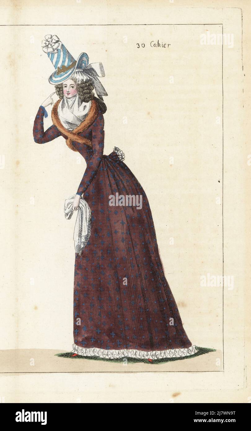 Woman in striped blue satin bonnet, white cockade, hair in ringlets, brown satin caraco or coureur and matching petticoat, Siberian fox shawl, and white gauze fichu. Handcoloured copperplate engraving from Jean-Antoine le Brun or Lebrun-Tossa’s Journal de la Mode et du Gout, previously Cabinet des Modes, Chez Buisson, Paris, and Joseph le Boffe, London, 30me Cahier, 15 December 1790. Stock Photo