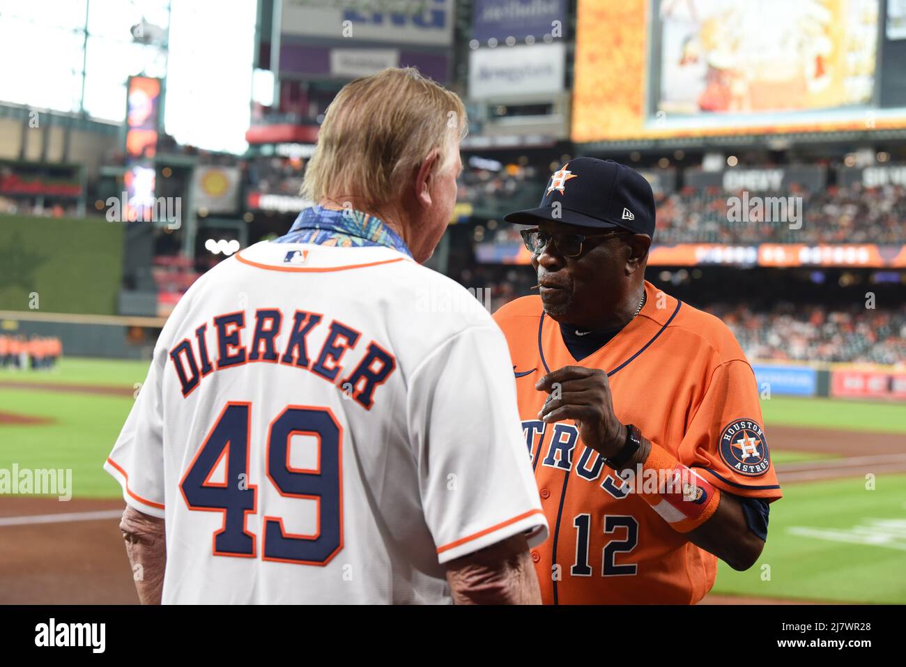 Former Houston Colt .45s/Astros Pitcher Larry Dierker talks with Houston Astros manager Dusty Baker Jr. (12) before the MLB game between the Houston A Stock Photo