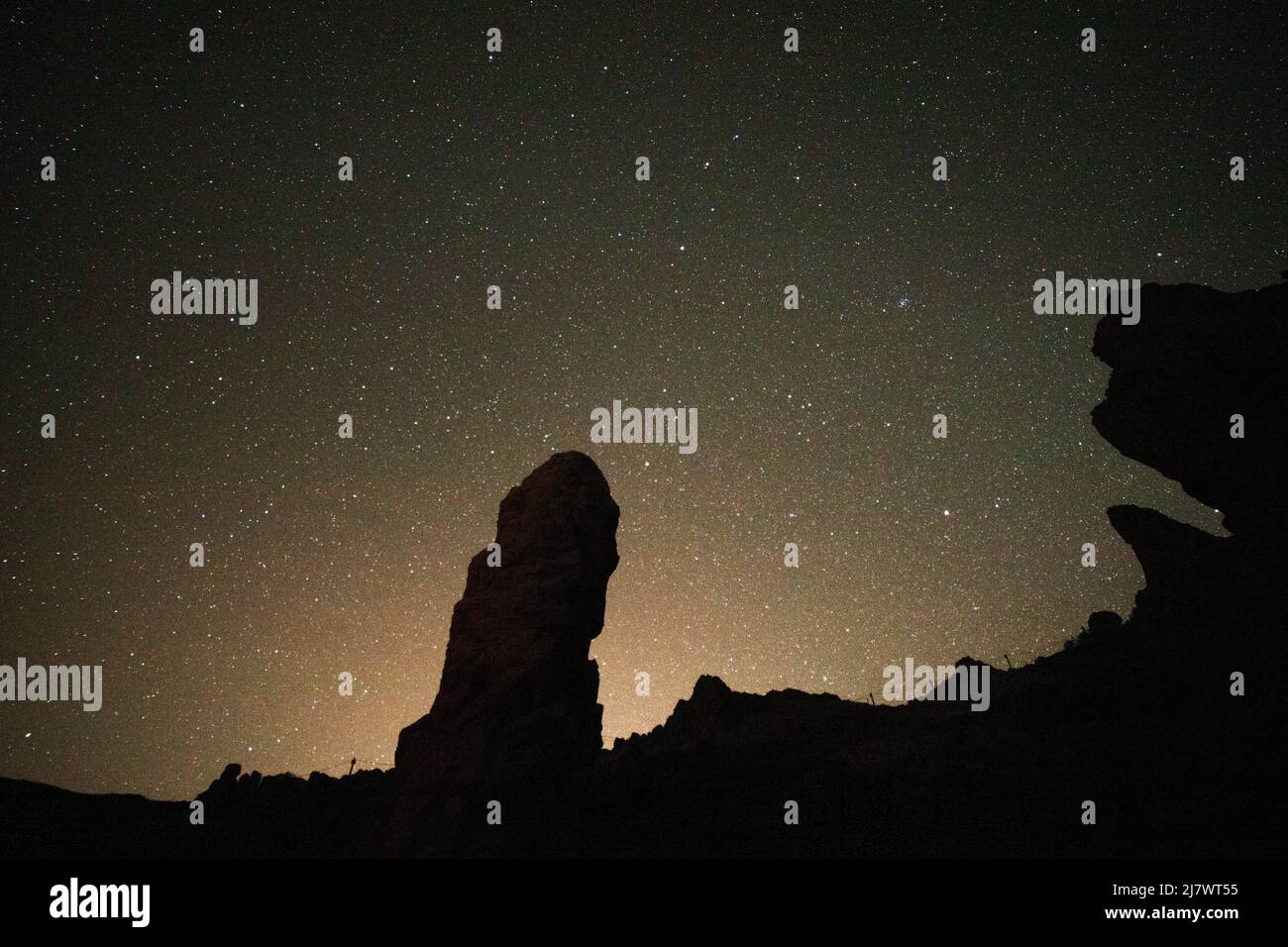 Stars in the night sky above Las Rochas in Teide National Park on Tenerife, Spain. Stock Photo