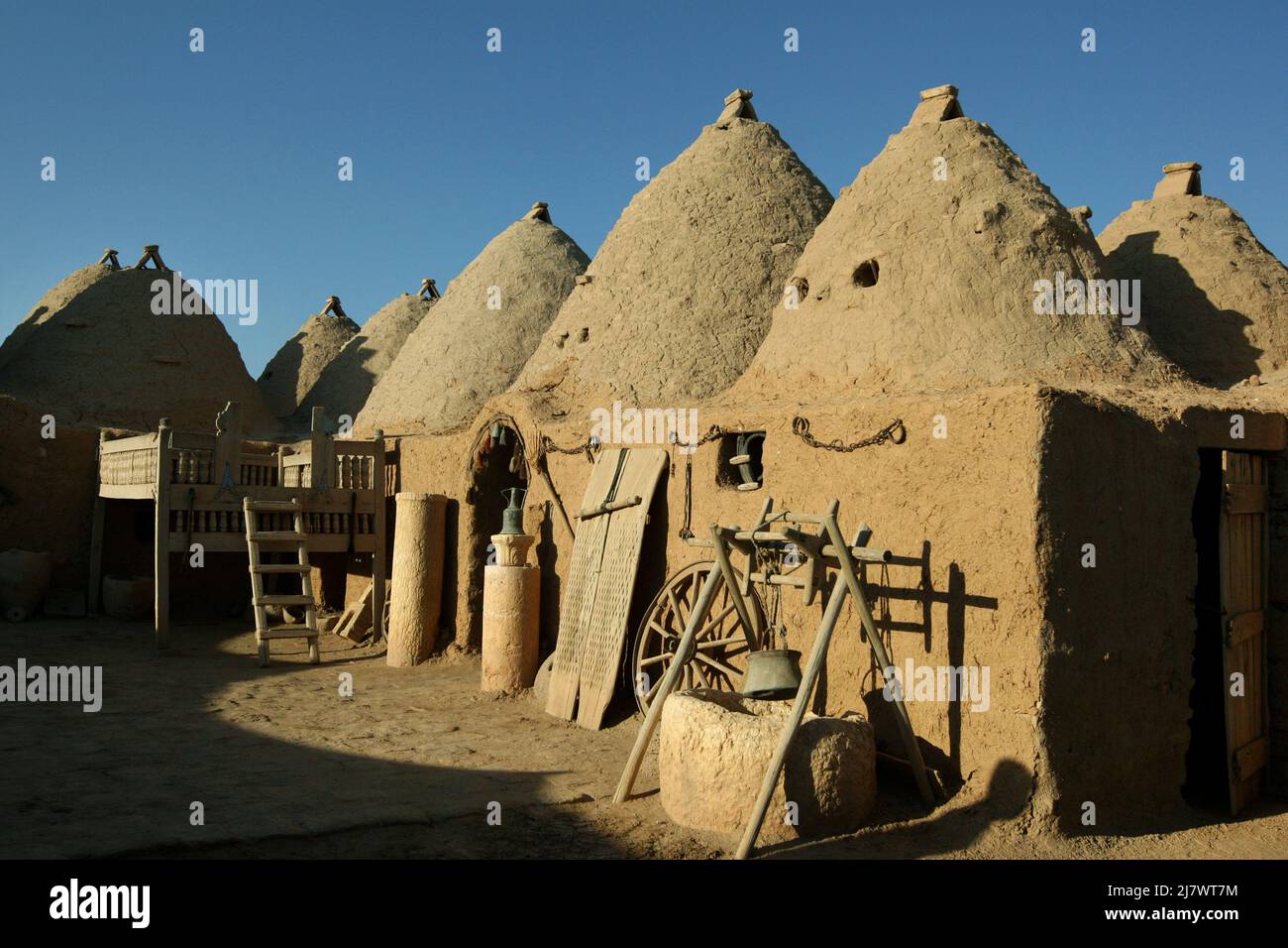 An ancient beehive home at Harran in Turkey. The homes are made of mud and clay bricks and are designed to reduce heat inside during summer. Stock Photo