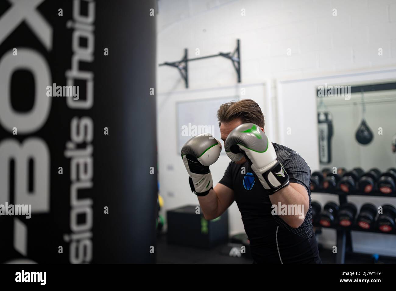 Ipswich Suffolk UK April 03 2022 A young sportsman doing a boxing based workout at gym, guy