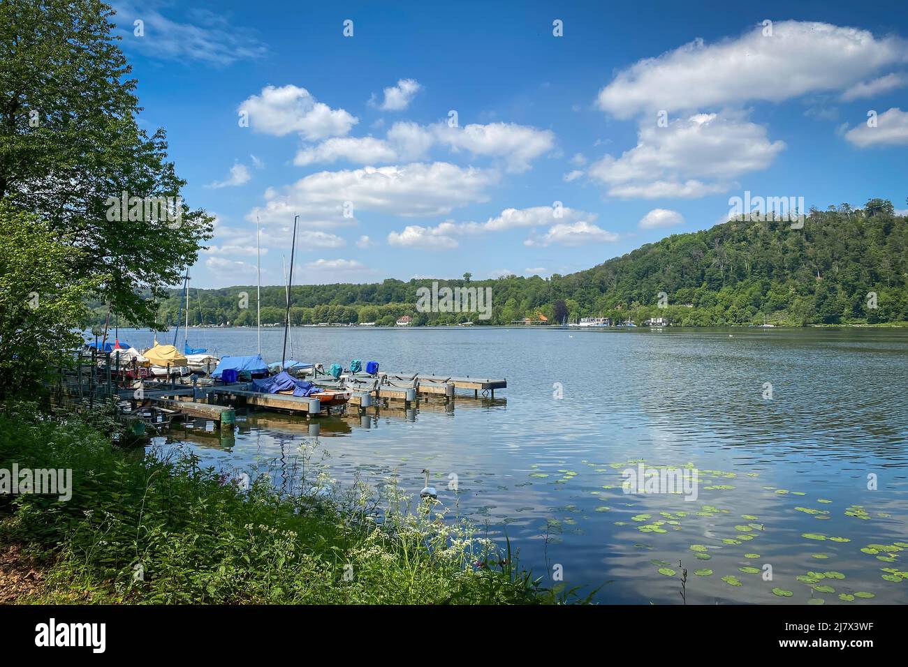 Boats on Lake Baldeney Baldeneysee near Essen, Germany against blue sky Stock Photo