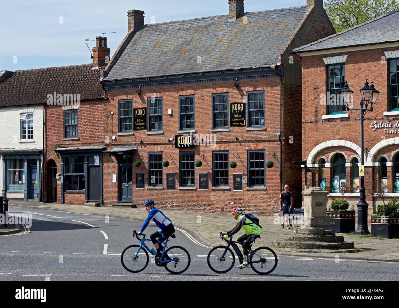 Cyclists in Epworth, North Lincolnshire, England UK Stock Photo