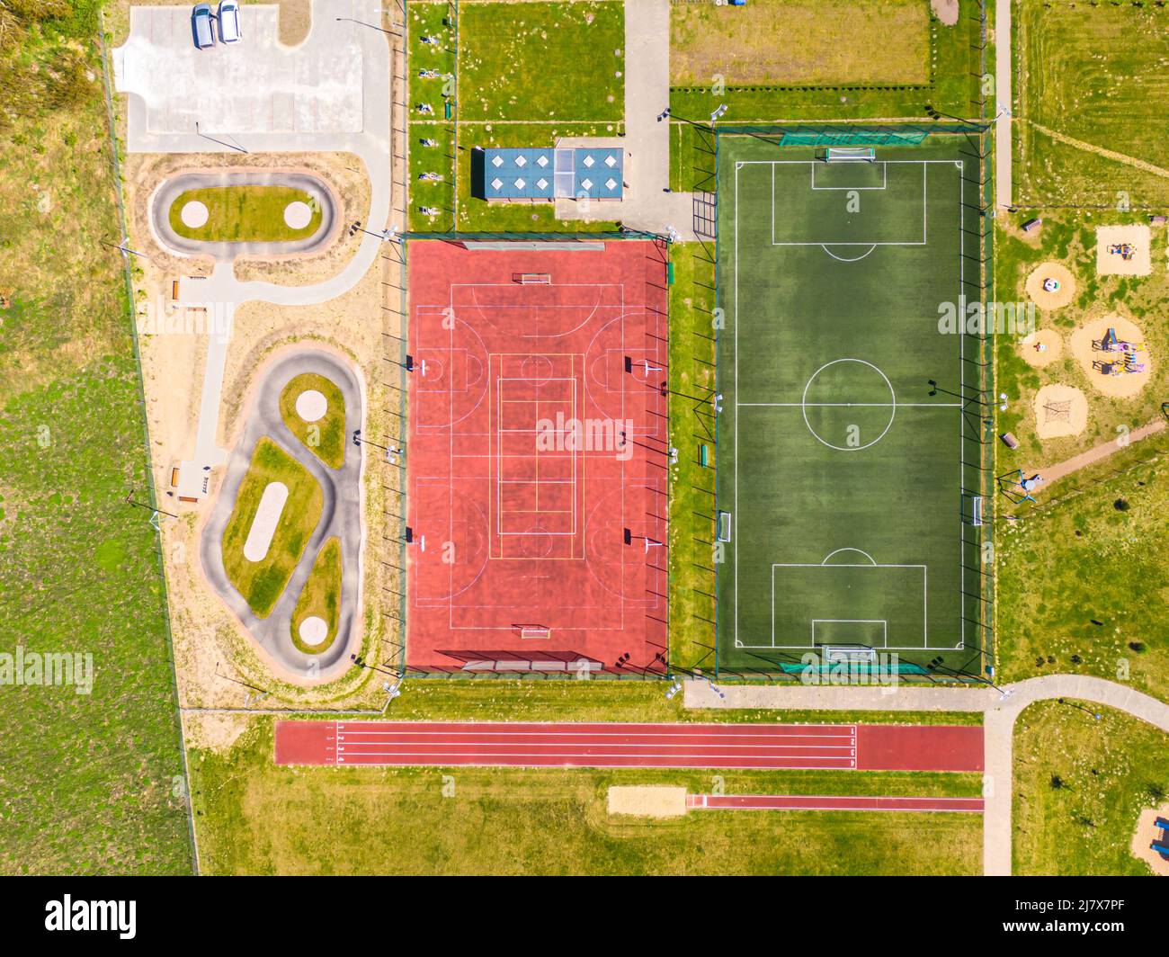 Aerial view of empty football field and basketball court hires stock