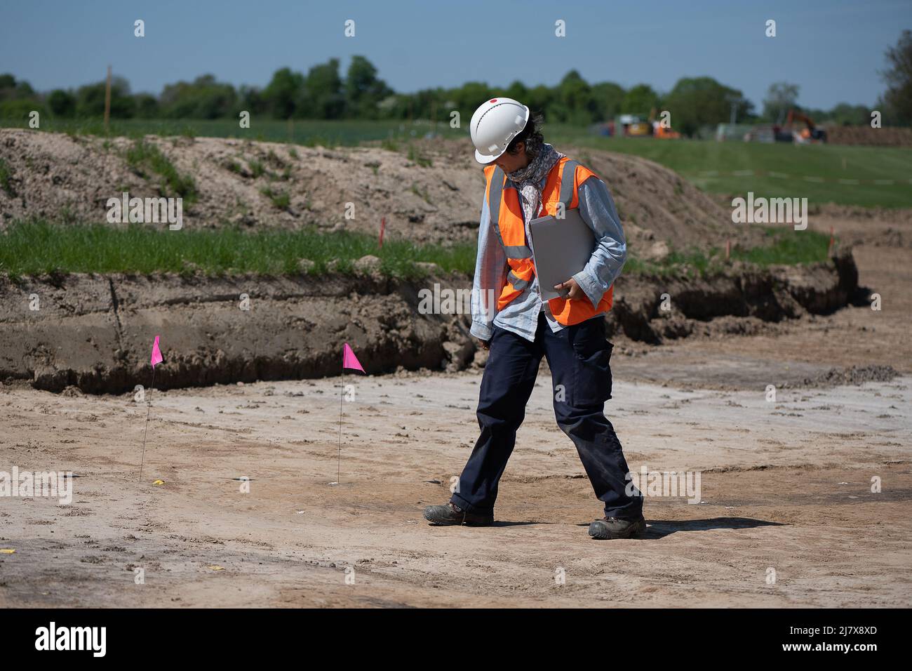 Lower Saxony, Göttingen: 11 May 2022, Sabine Stoffner, excavation manager, stands on the archaeological site. The electricity grid operator Tennet has discovered a settlement and a burial site from the Neolithic period during civil engineering work in Göttingen. Photo: Swen Pförtner/dpa Stock Photo