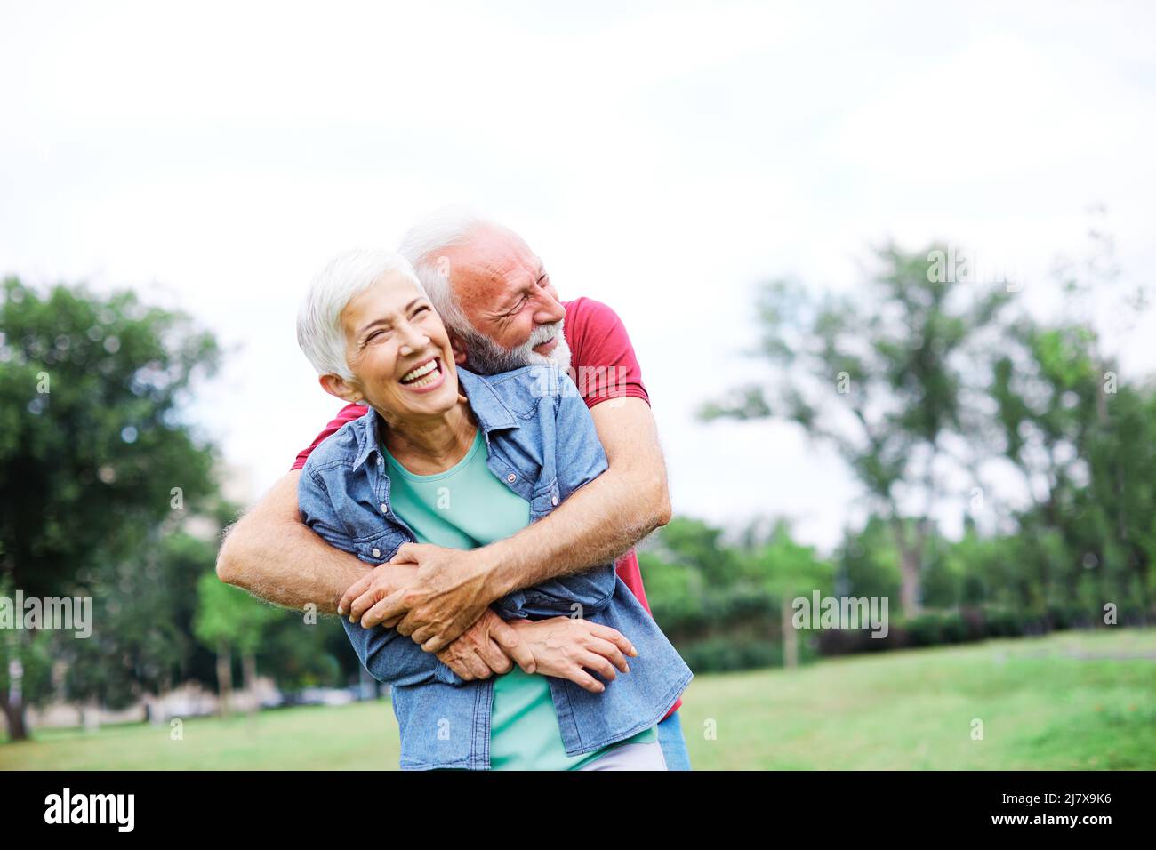 senior couple happy elderly love together retirement lifestyle smiling man woman mature fun Stock Photo