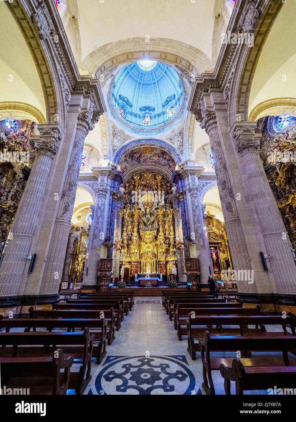 Central nave and the main altarpiece of the Collegiate Church of the Divine Savior - Seville, Spain Stock Photo
