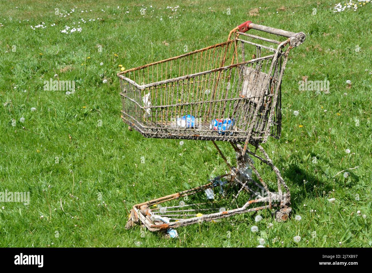 Corroded supermarket trolley after being recovered from a river. Stock Photo