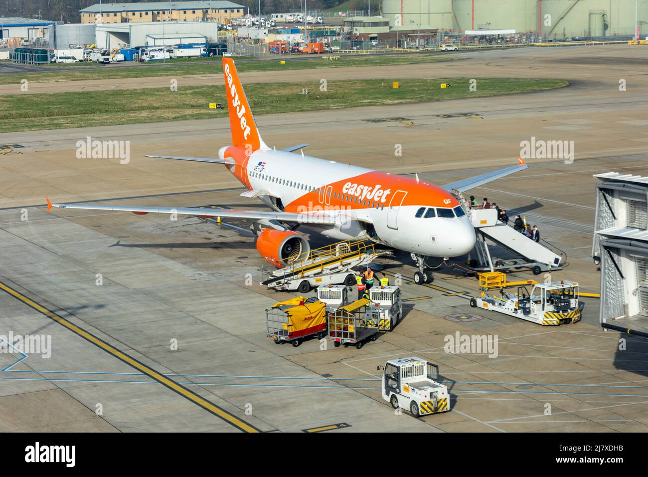 Passengers boarding Easyjet Airbus A319-111 flight at North Terminal, London Gatwick Airport, Crawley, West Sussex, England, United Kingdom Stock Photo