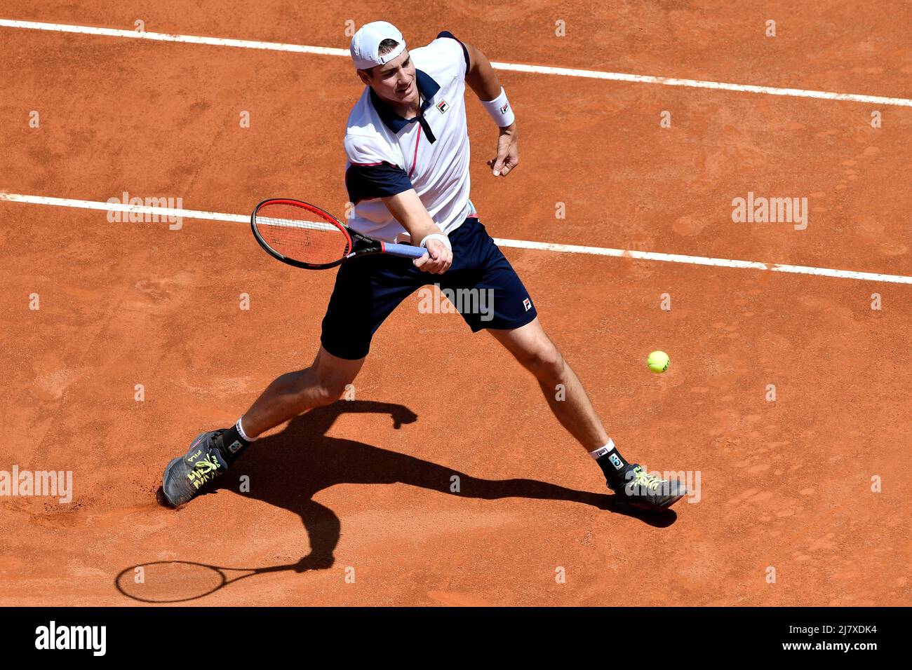 Rome, Italy. 11th May, 2022. John Isner of United States returns to Rafael  Nadal of Spain during their second round match at the Internazionali BNL  D'Italia tennis tournament at Foro Italico in