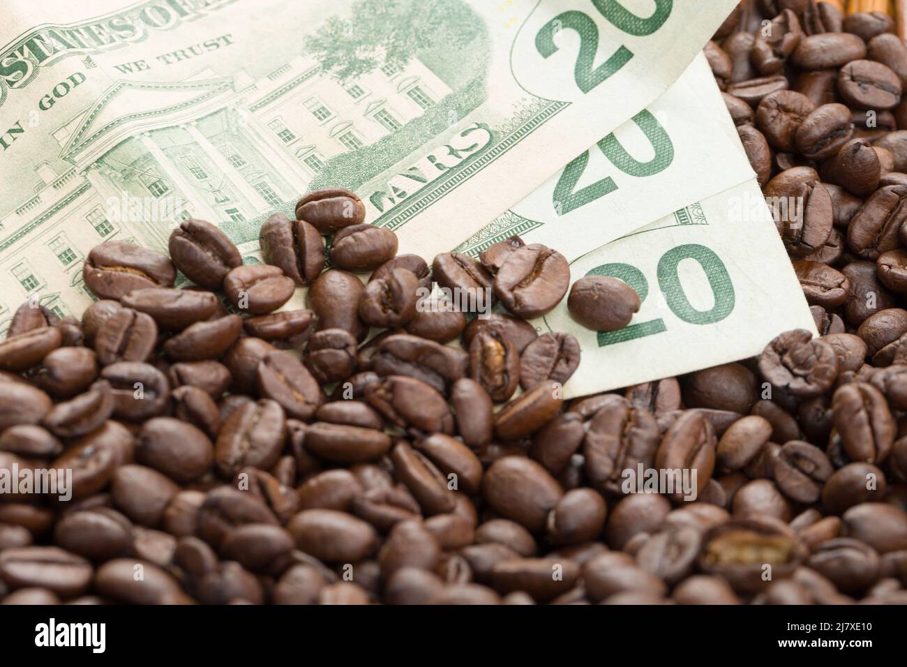 increasing coffee prices symbolic picture of coffee beans and dollar bills Stock Photo Alamy