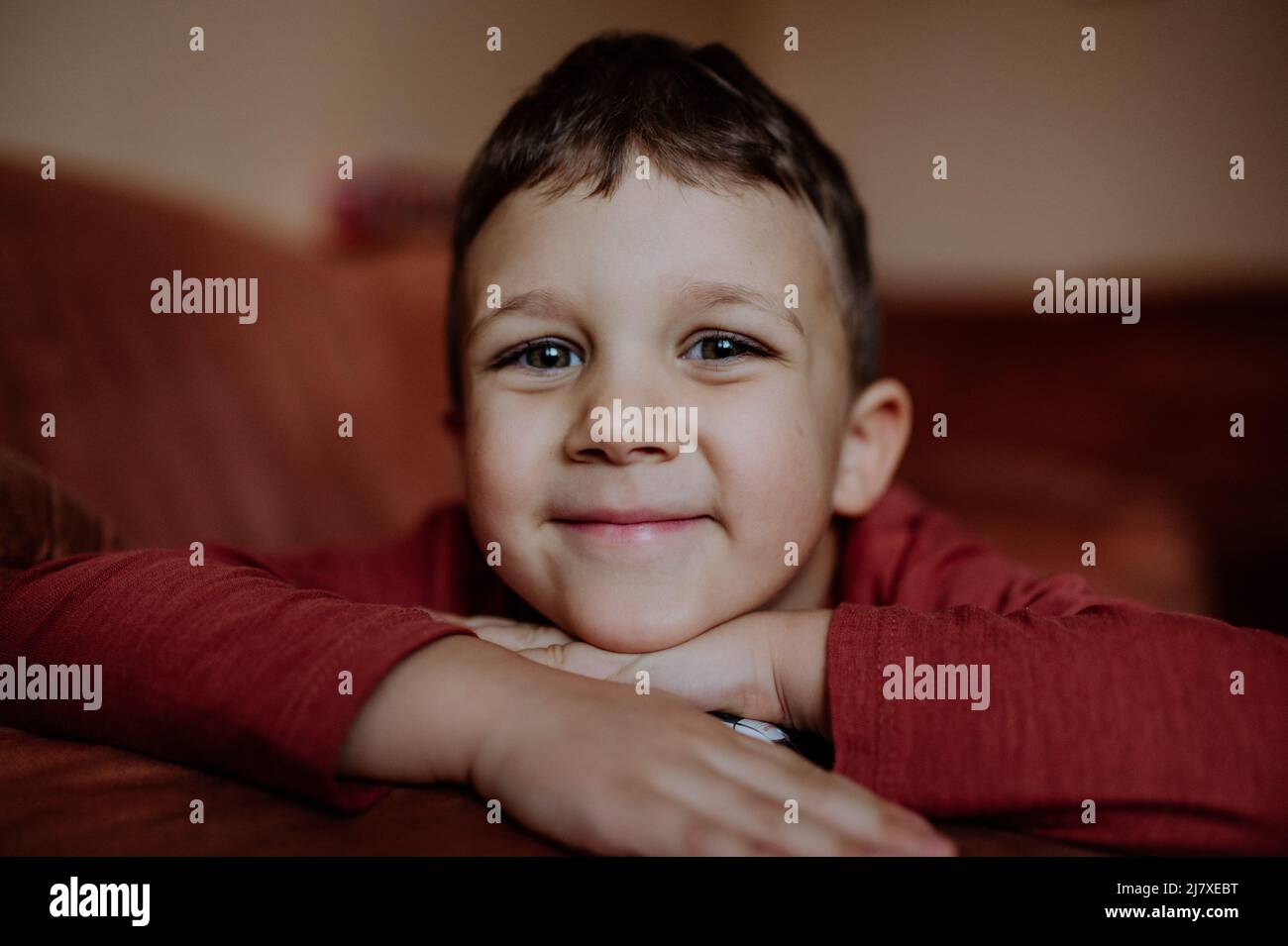 Portrait of cute litttle boy smiling at looking at camera Stock Photo ...