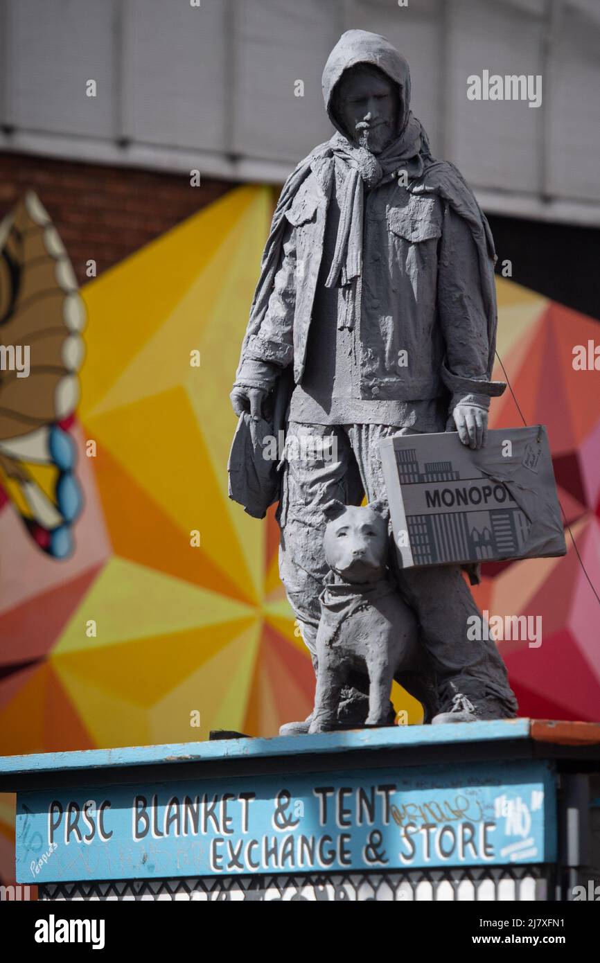 Jamaica Street, Stokes Croft, Bristol, UK. 8th April 2022. A new sculpture has been erected in Bristol depicting a man holding a Monopoly set alongsid Stock Photo