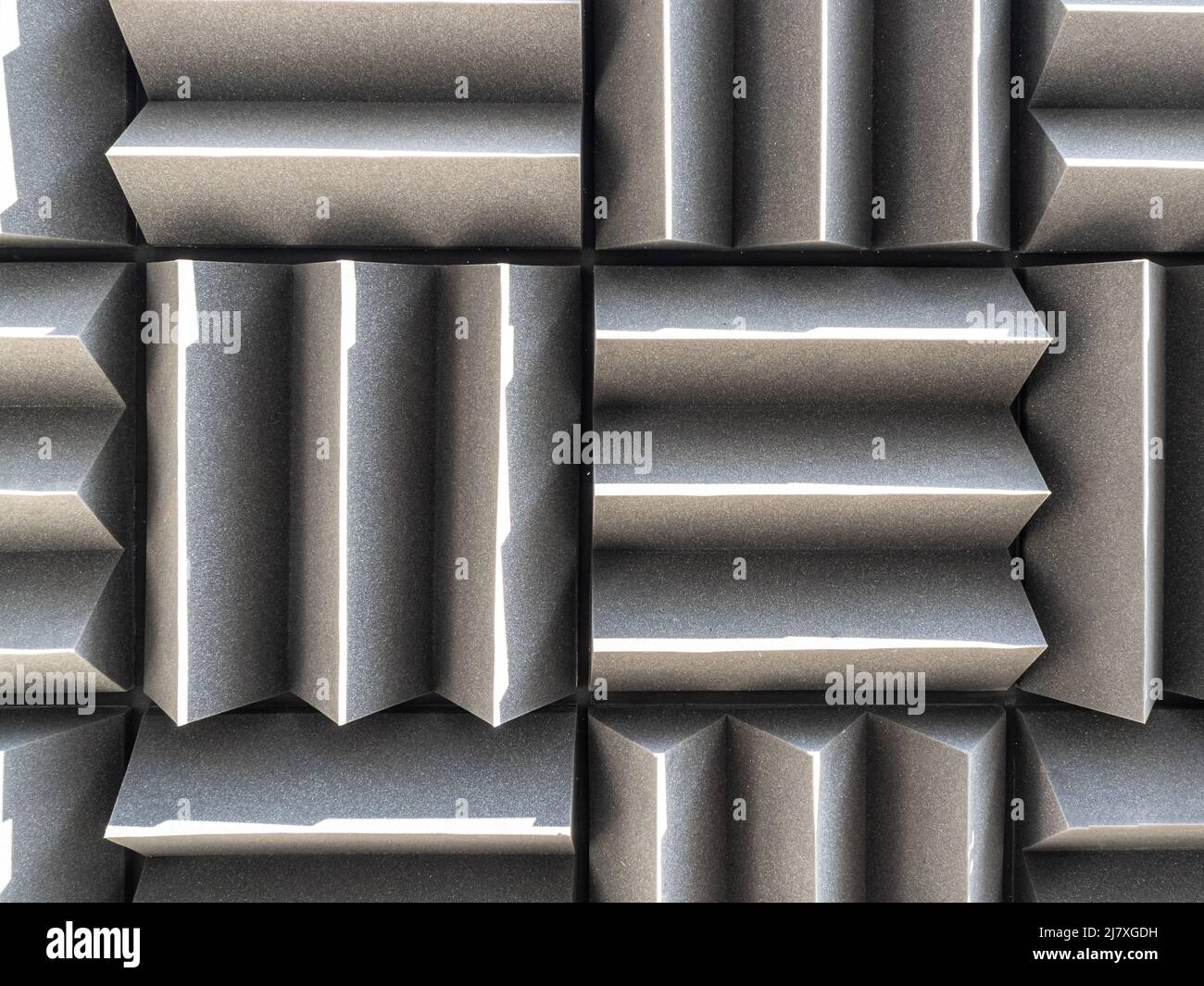 Grey dampening acoustic foam in the vocal recording room. Stock Photo