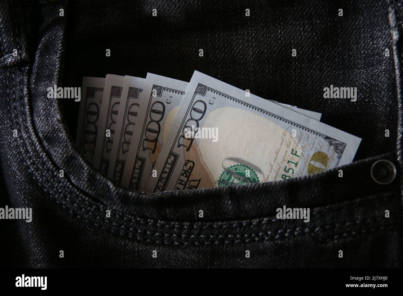 Hundred dollar bills in jeans pocket, business concept. Stock Photo