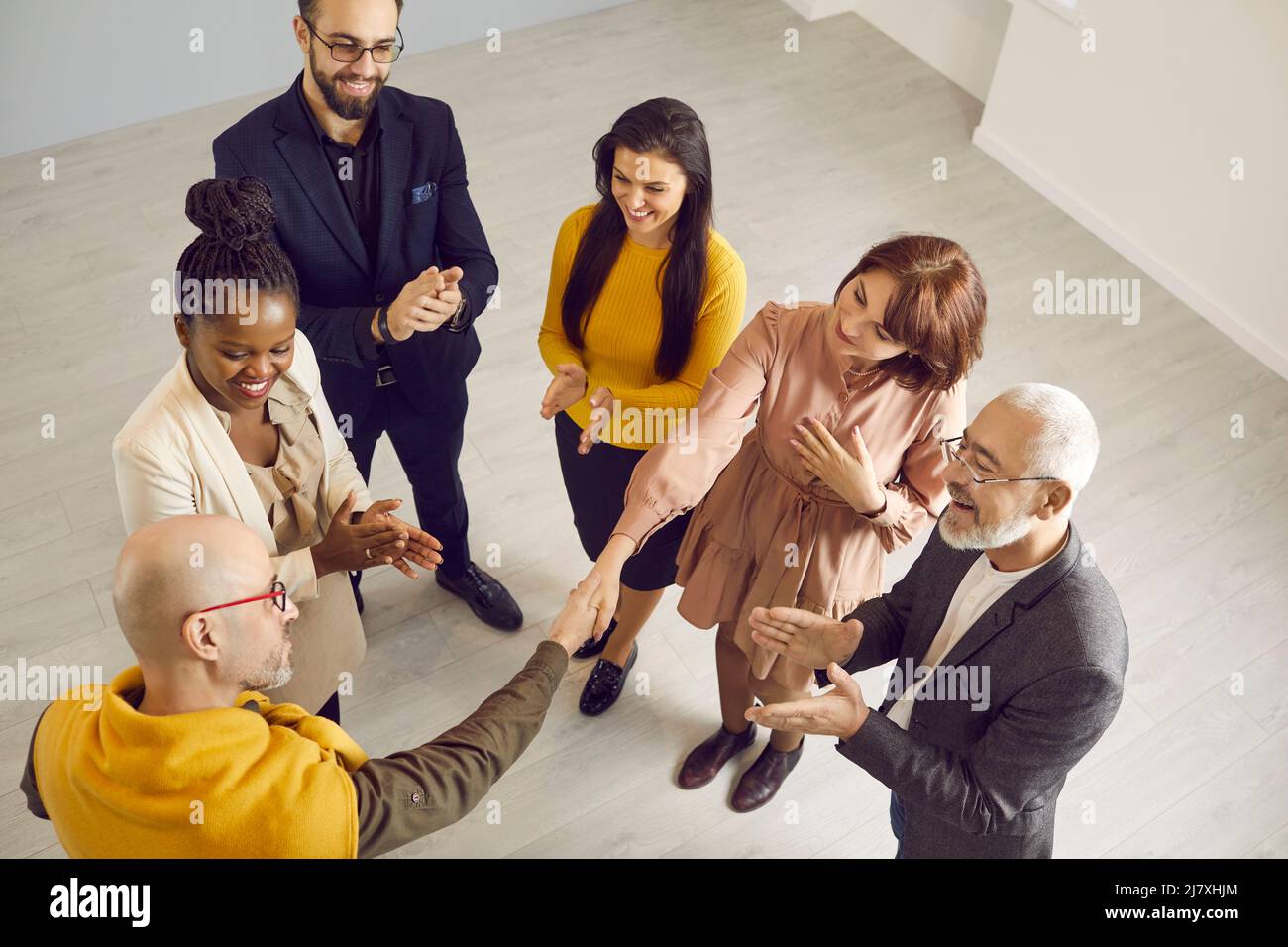 Smiling businesspeople shake hands make agreement Stock Photo