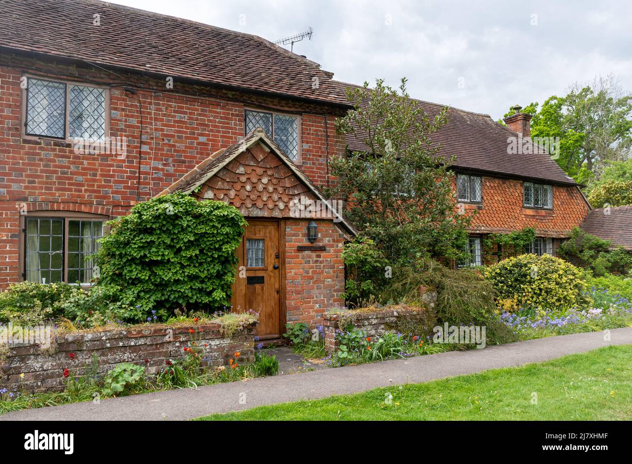 Attractive cottages and gardens in Dunsfold village, Surrey, England, UK Stock Photo