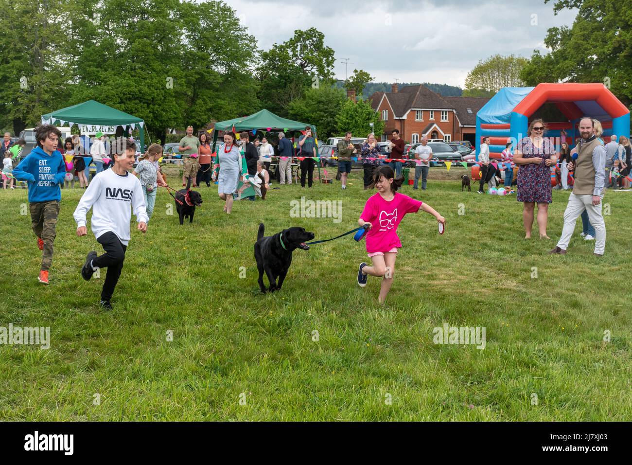 Dunsfold village fete, Surrey, England, UK, with a dog show in the arena. Stock Photo
