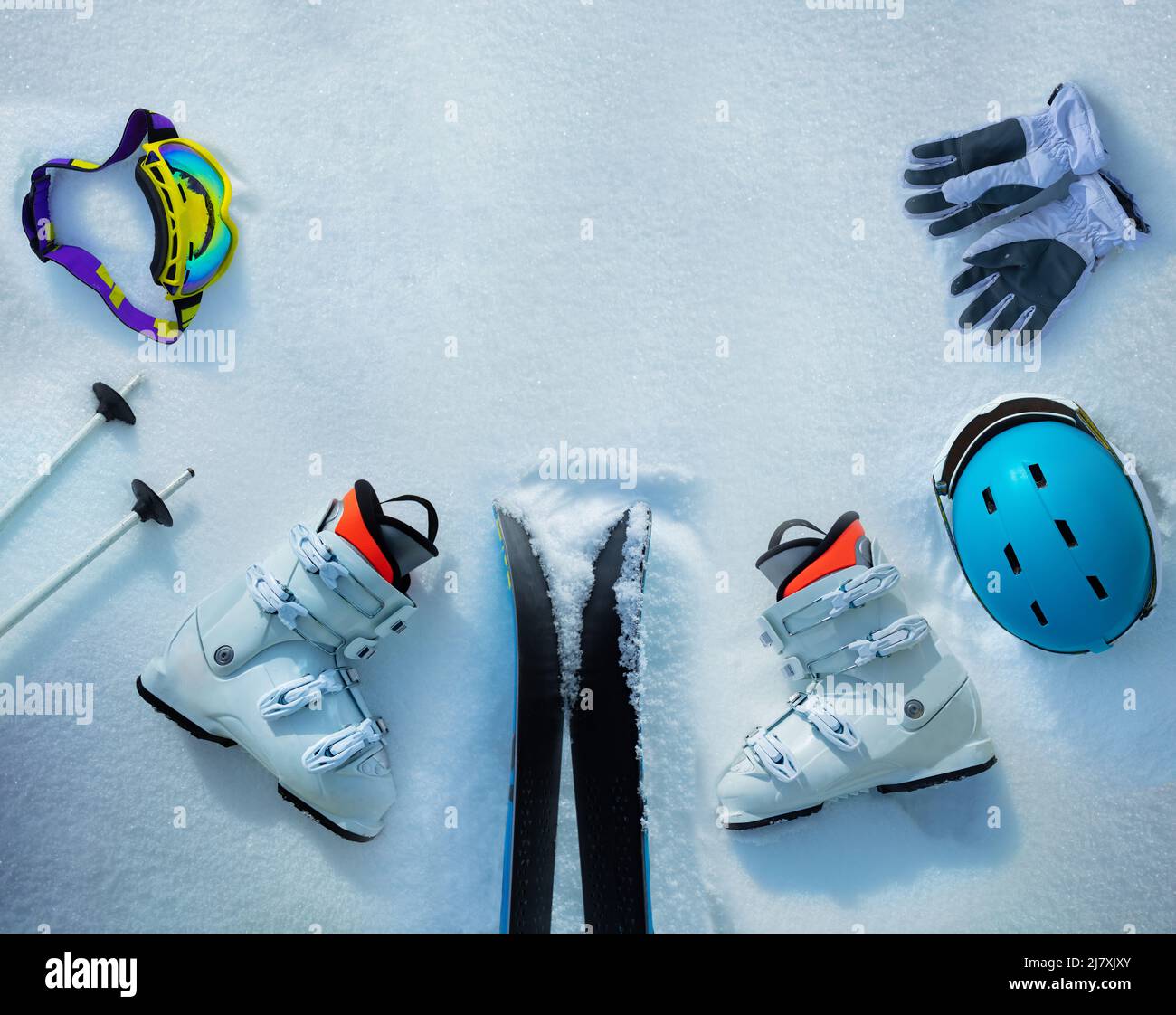 Group of objects ski boots, helmets, masks in the snow Stock Photo