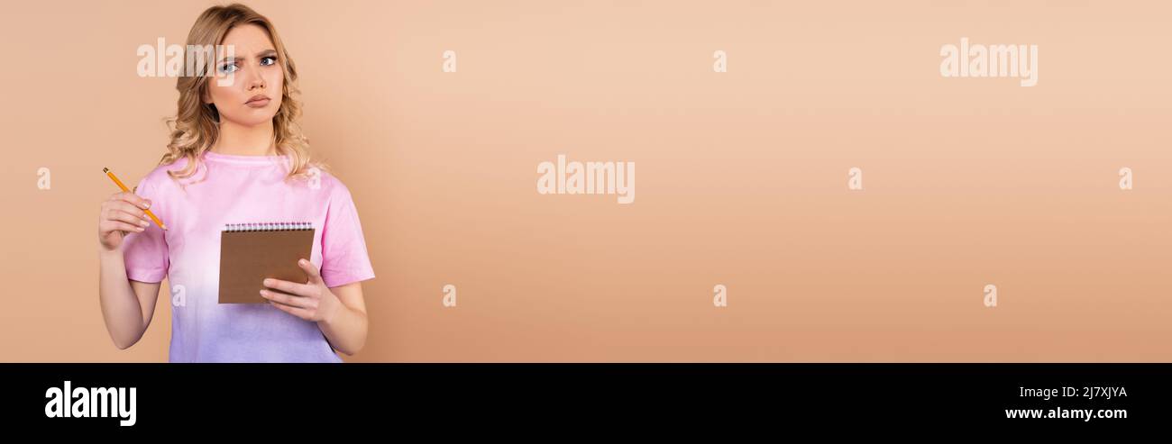 Woman thinking holding pencil hi-res stock photography and images - Alamy