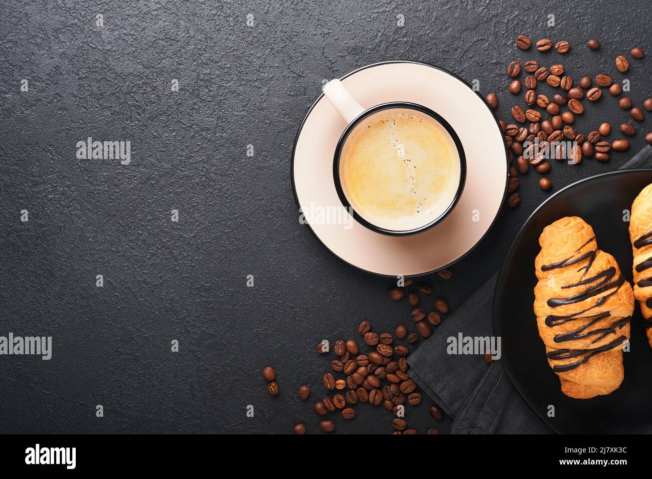 Coffee and croissant. Espresso coffee and croissant with chocolate on