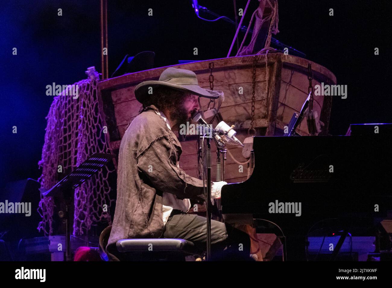 Vinicio Capossela, an Italian sing-song writers and multi-instrumentalist player, performs in Teatro Romano (Verona) at 22 July 2021 for his tour. Stock Photo