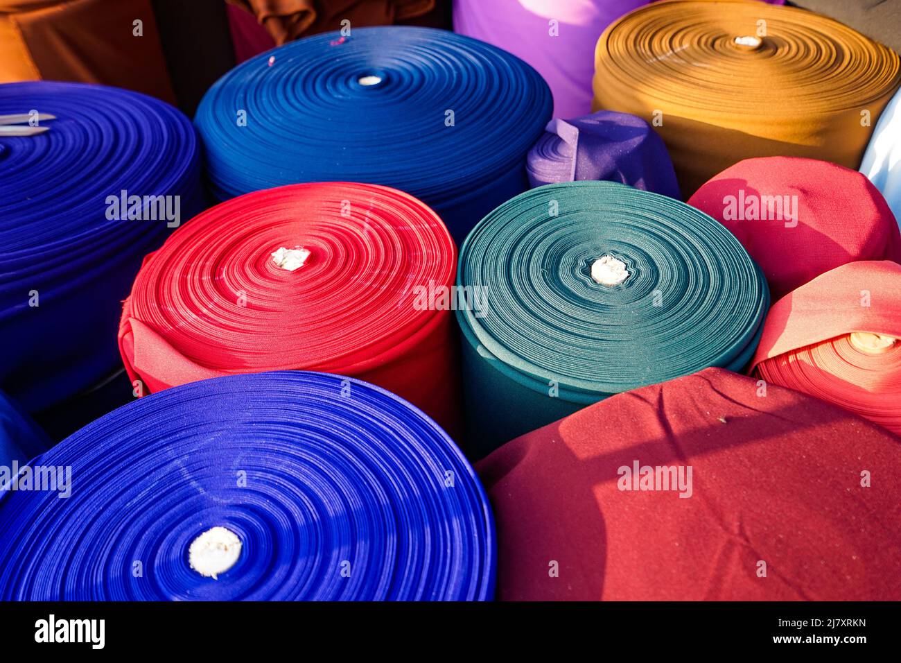Colorful fabric rolls at a Vietnamese fabric market Stock Photo Alamy