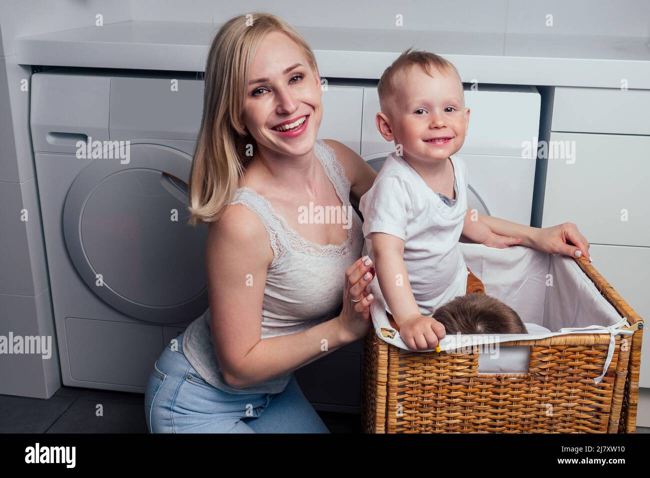 happy family home weekend morning bathroom washing machine.mother and