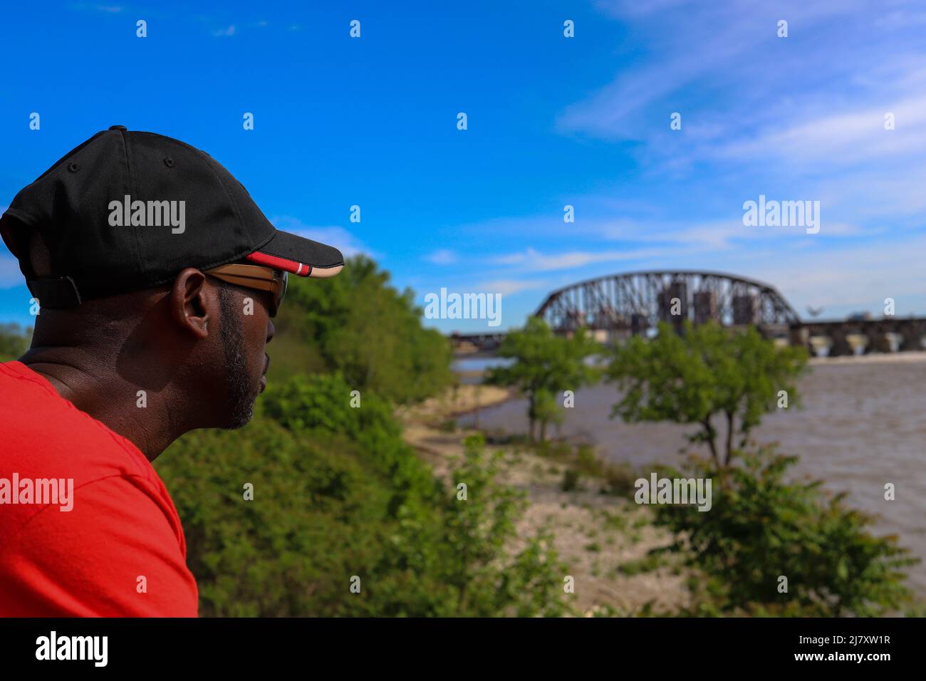A portrait of a black African-American man looking at river Stock Photo